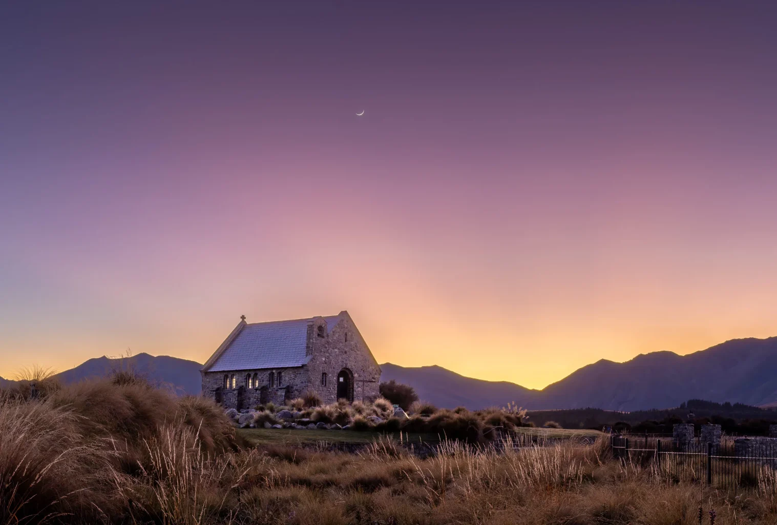purple sky and a church